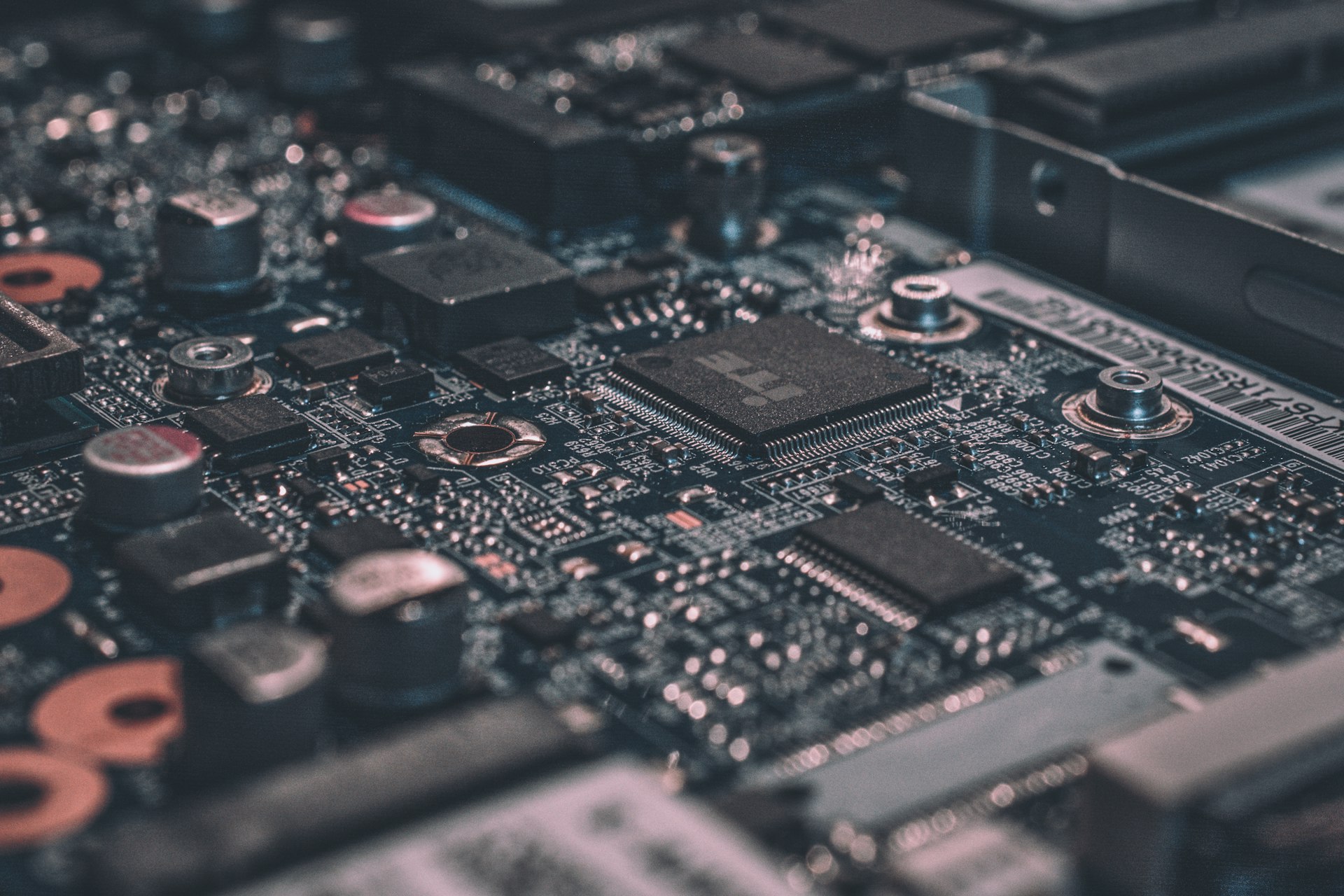 Macro photo of a computer motherboard with an ITE chip and capacitors