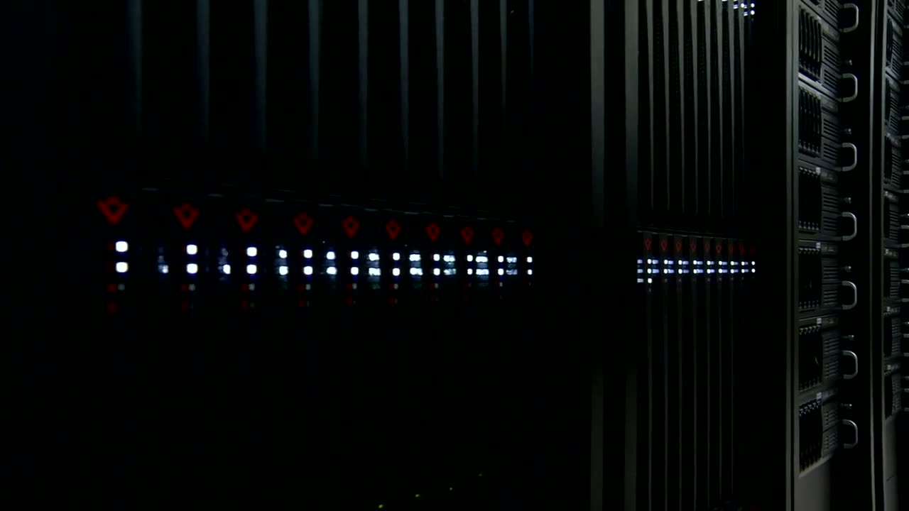 Dark data-center aisle of rack-mounted servers with white status lights